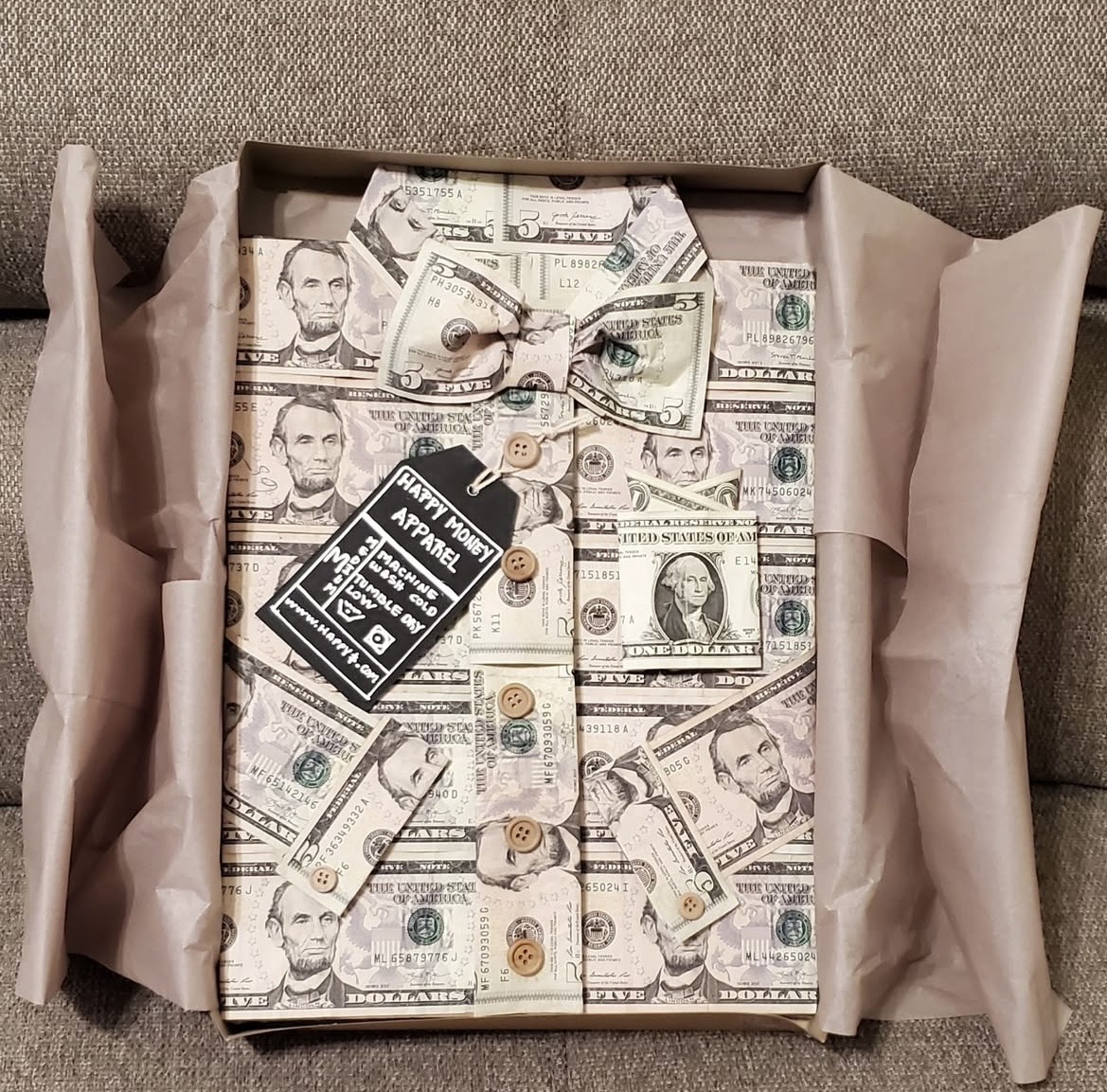 Creative money-themed gift wrapping shaped like a dress shirt in a gift box